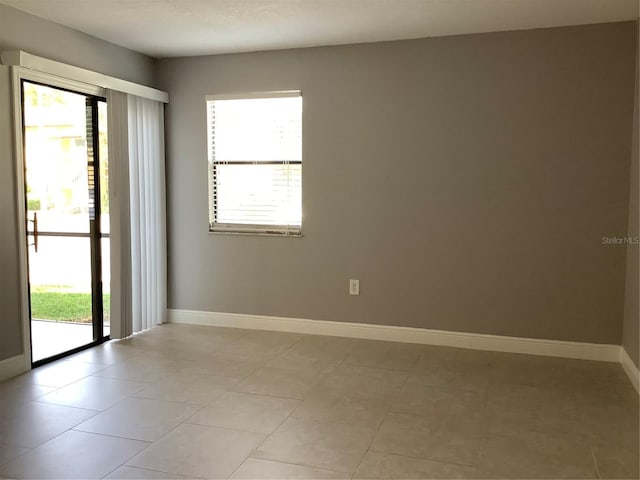 empty room with light tile patterned floors