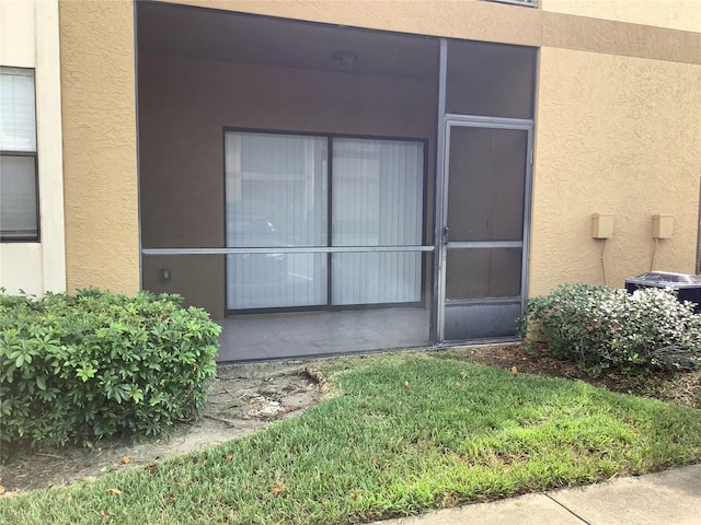 entrance to property featuring central AC