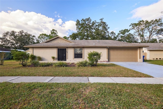 ranch-style home with a front yard and a garage