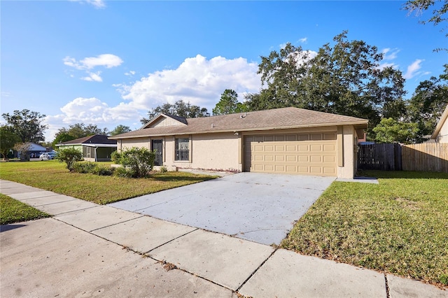 ranch-style house featuring a front lawn and a garage