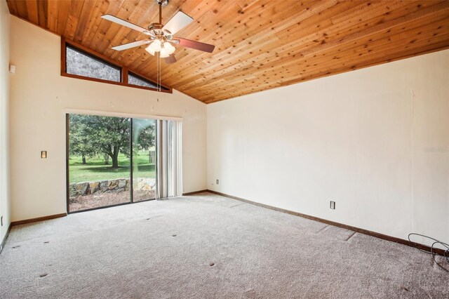 carpeted spare room with ceiling fan, wooden ceiling, and high vaulted ceiling