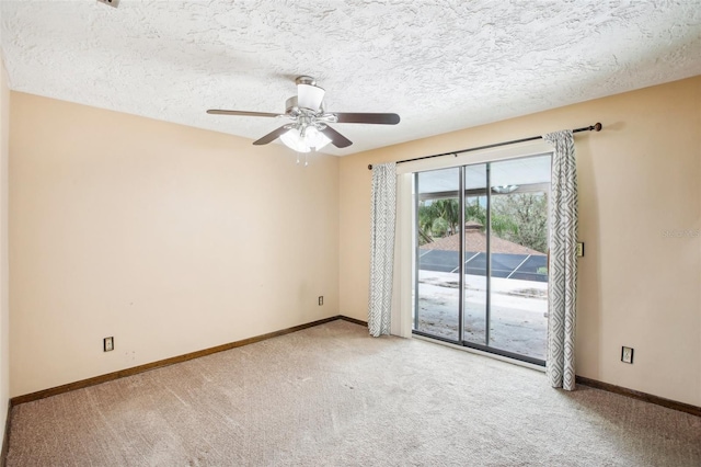 carpeted empty room featuring a textured ceiling and ceiling fan