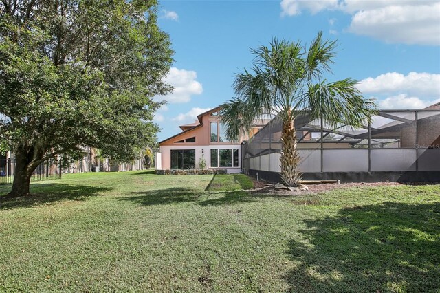 view of yard featuring a lanai