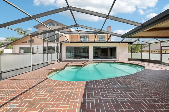 view of pool featuring a lanai and a patio area