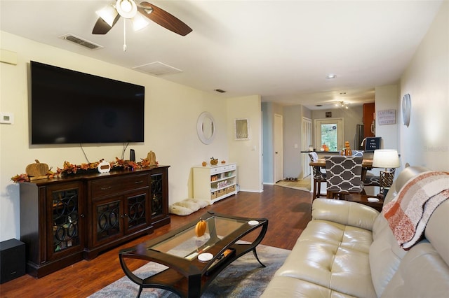 living room with ceiling fan and wood-type flooring