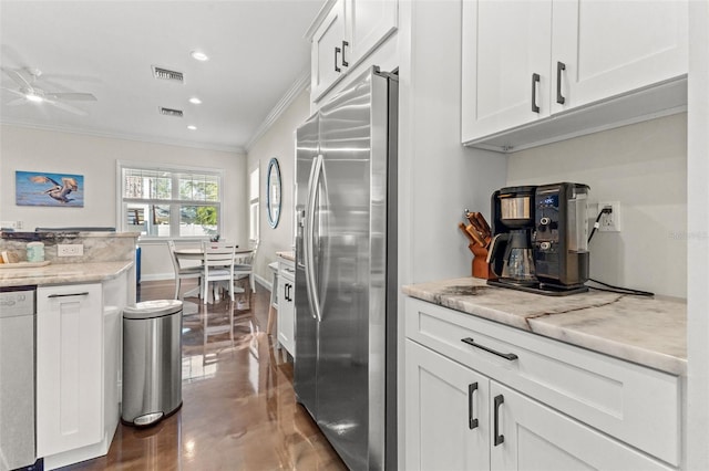 kitchen featuring white cabinetry, dishwasher, ceiling fan, stainless steel fridge, and ornamental molding