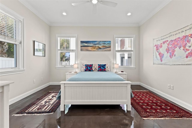 bedroom featuring multiple windows, ceiling fan, and ornamental molding