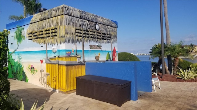 view of patio featuring a water view