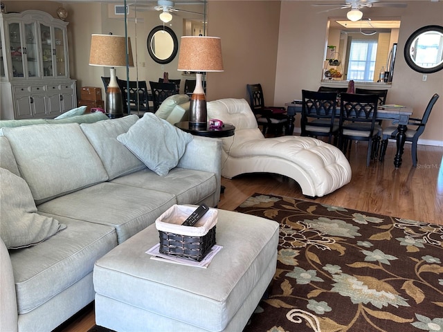 living room with hardwood / wood-style flooring and ceiling fan