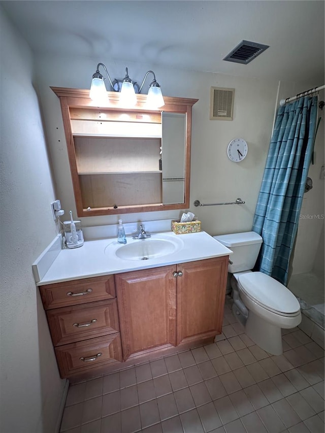 bathroom featuring vanity, toilet, walk in shower, and tile patterned flooring