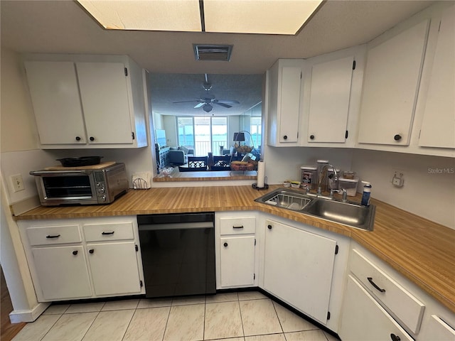 kitchen with sink, dishwasher, a textured ceiling, white cabinetry, and ceiling fan