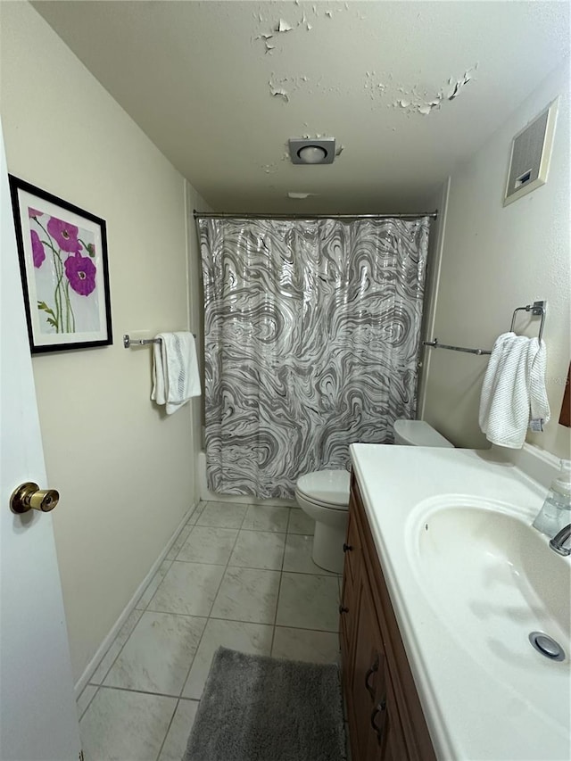 bathroom featuring toilet, curtained shower, vanity, and tile patterned flooring