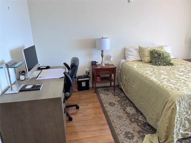 bedroom with light wood-type flooring