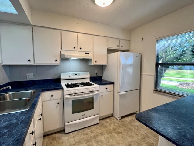 kitchen featuring sink, tasteful backsplash, a textured ceiling, white appliances, and white cabinets