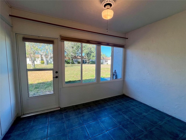 interior space with dark tile patterned floors