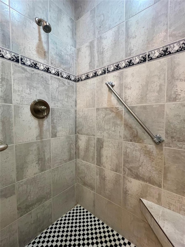 bathroom with tiled shower