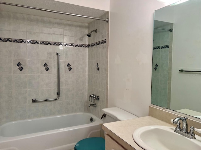 full bathroom with vanity, toilet, and tiled shower / bath combo