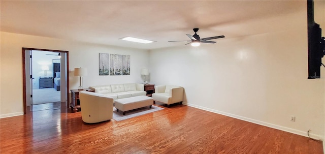 living room with hardwood / wood-style flooring and ceiling fan