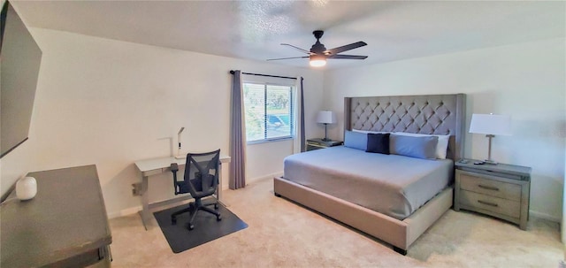 bedroom with ceiling fan and light colored carpet