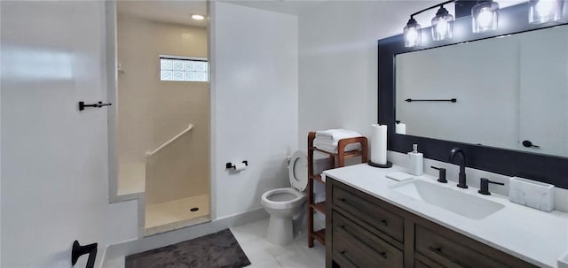 bathroom featuring toilet, a shower, vanity, and tile patterned flooring