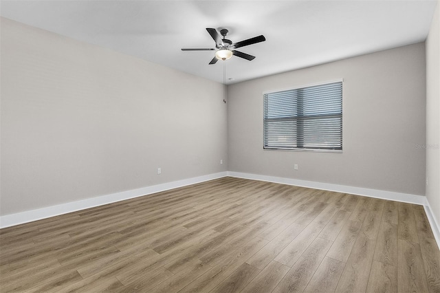 spare room with light hardwood / wood-style floors and ceiling fan