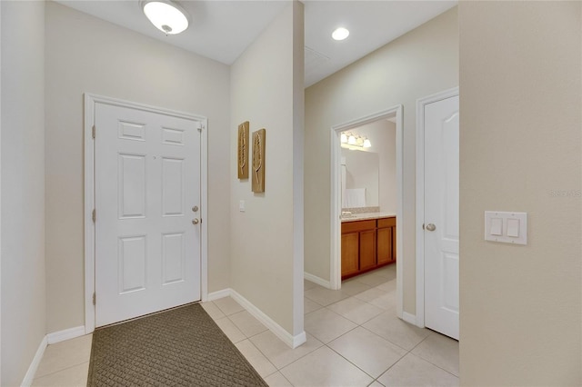 entrance foyer featuring light tile patterned floors