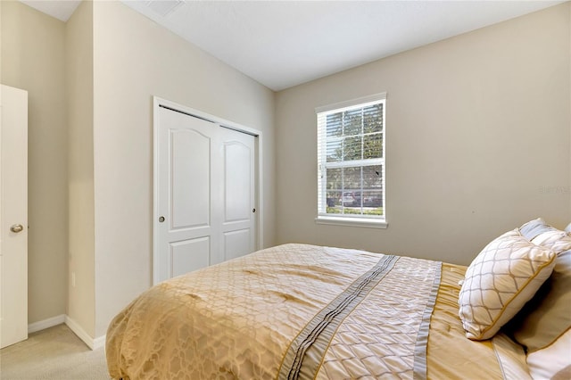 carpeted bedroom with a closet