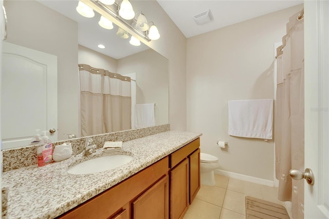 bathroom with vanity, curtained shower, toilet, and tile patterned flooring