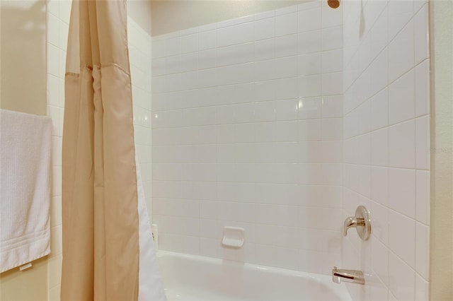 bathroom with shower / bathtub combination with curtain