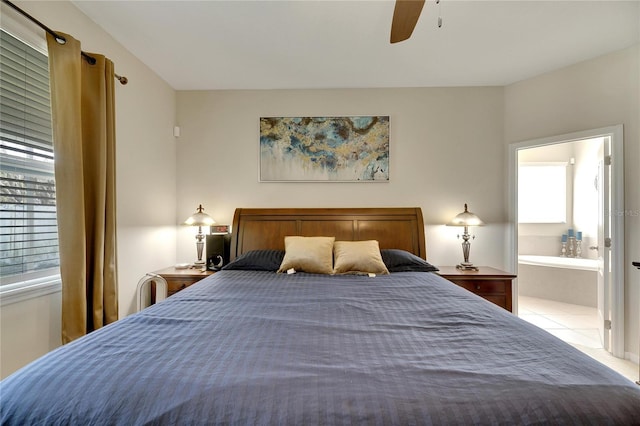 bedroom featuring ensuite bathroom and ceiling fan