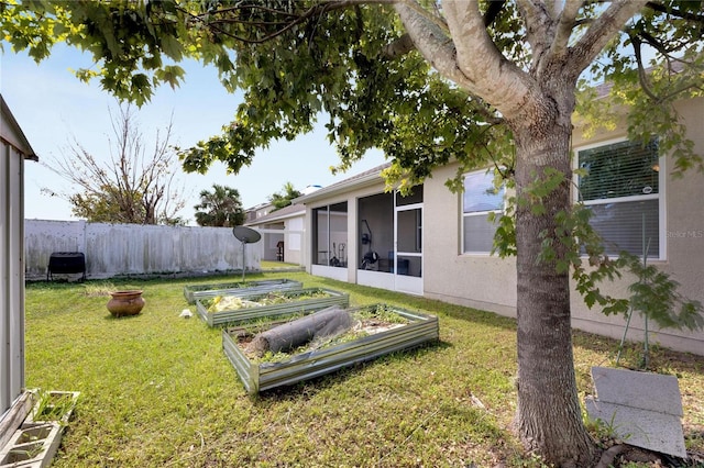 view of yard with a sunroom