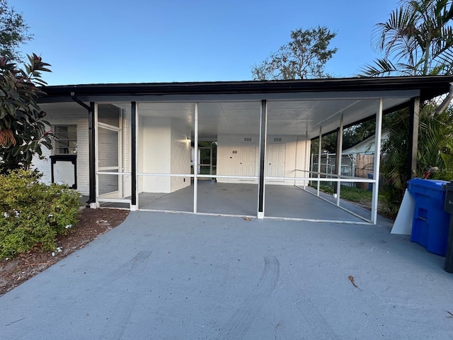 exterior space with a carport