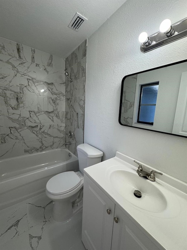 full bathroom featuring a textured ceiling, vanity, toilet, and tiled shower / bath