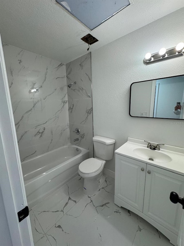 full bathroom featuring a textured ceiling, vanity, tiled shower / bath combo, and toilet