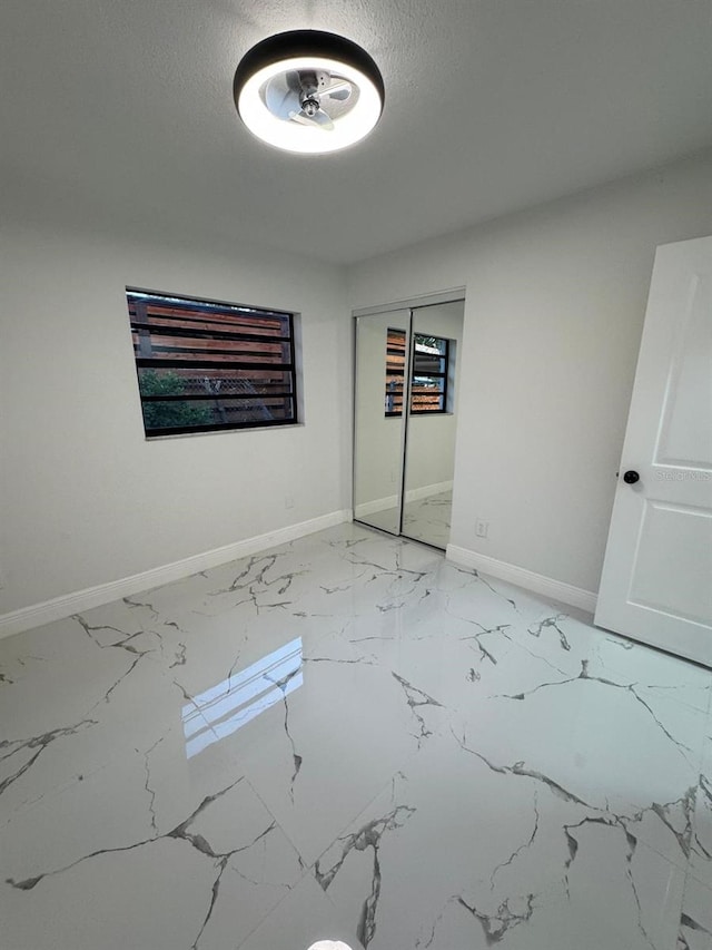 unfurnished room with a textured ceiling