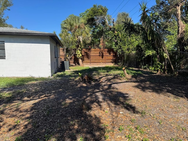 view of yard with central AC