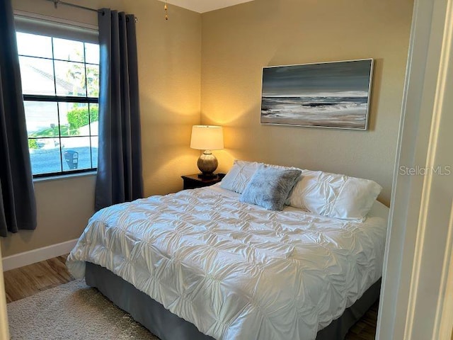 bedroom with wood-type flooring