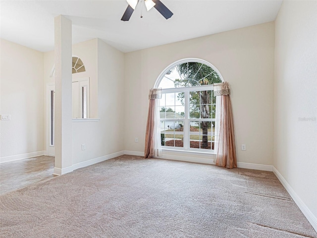 carpeted empty room with ceiling fan