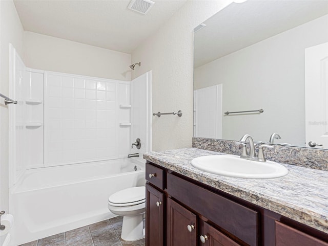 full bathroom with tile patterned floors, vanity, shower / tub combination, and toilet