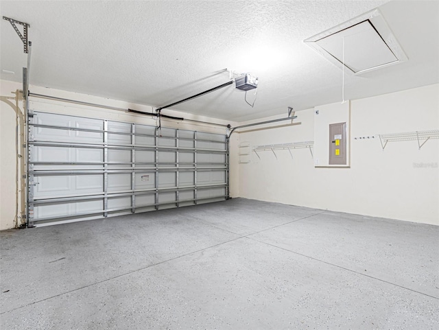 garage with electric panel and a garage door opener