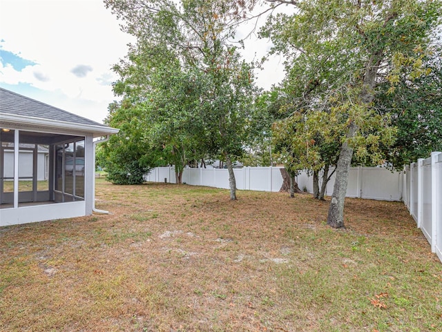 view of yard with a sunroom