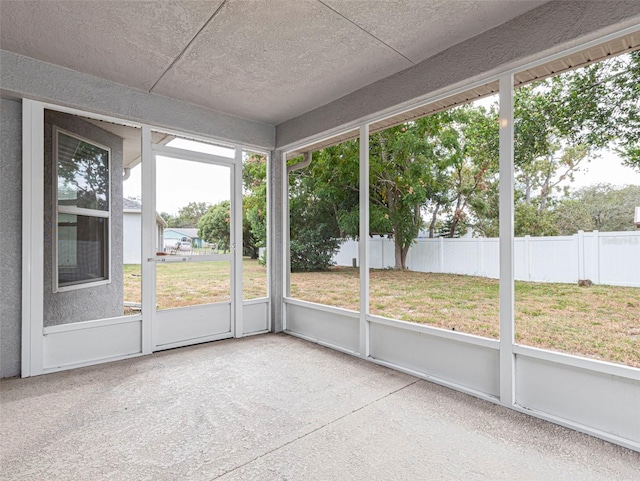 unfurnished sunroom featuring plenty of natural light