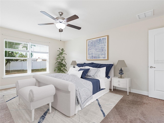 carpeted bedroom with ceiling fan