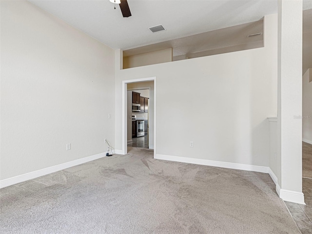 carpeted empty room with ceiling fan