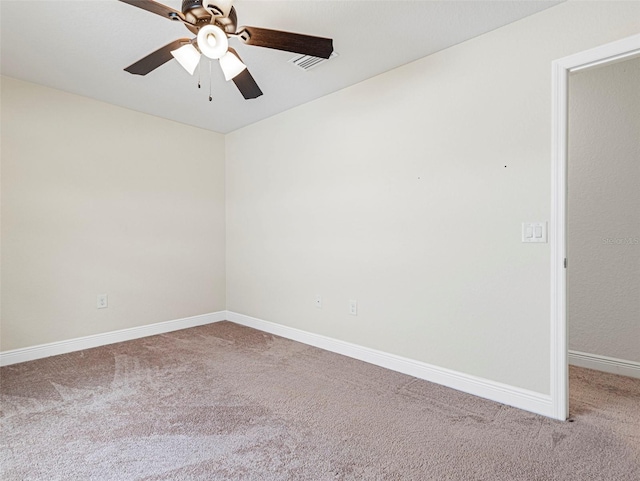 carpeted empty room with ceiling fan