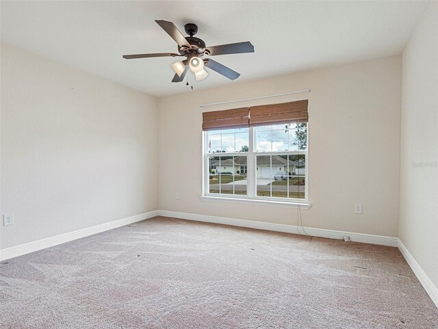 carpeted empty room with ceiling fan