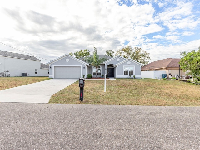 ranch-style house featuring central AC unit, a front yard, and a garage