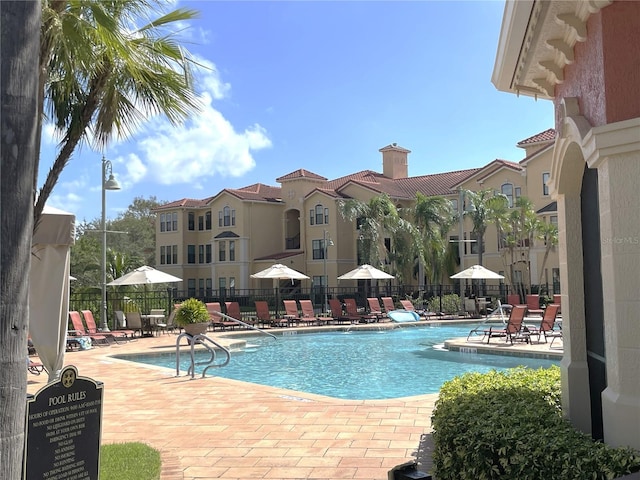 view of swimming pool with a patio area