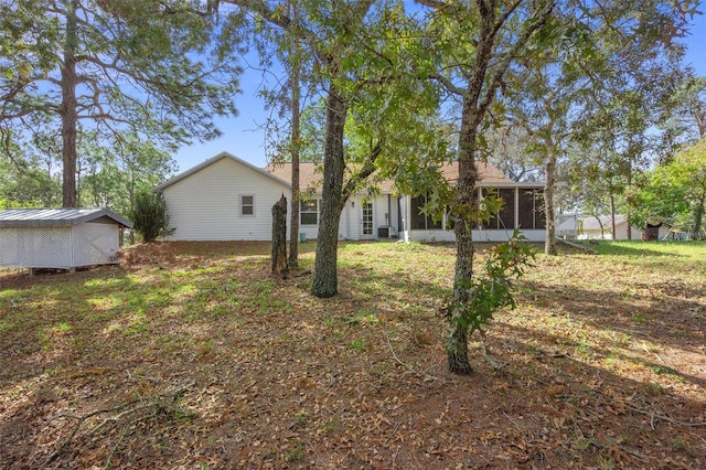 view of yard with a sunroom