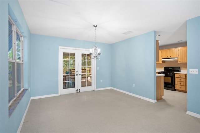 interior space featuring french doors and a notable chandelier